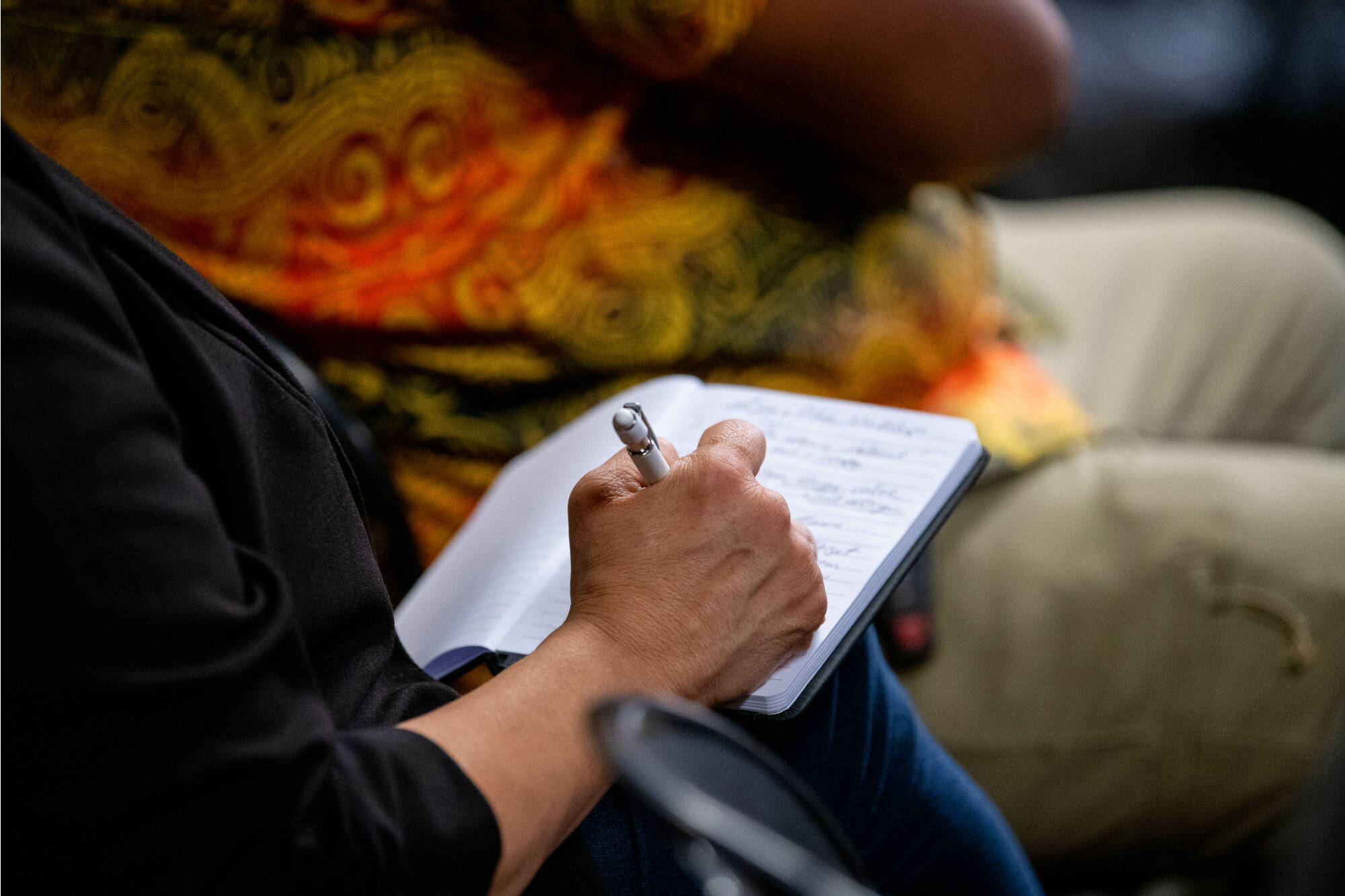 writing in a notebook